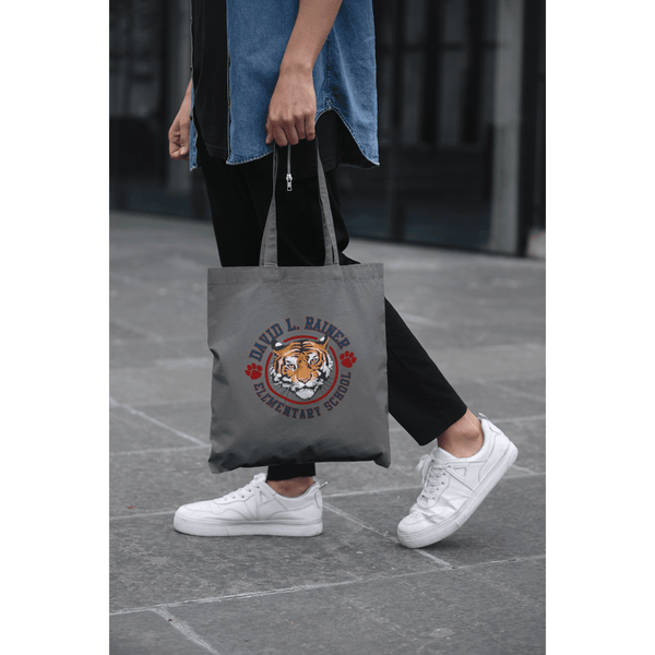 cropped-face-mockup-of-a-man-holding-a-tote-bag-in-the-street-29424