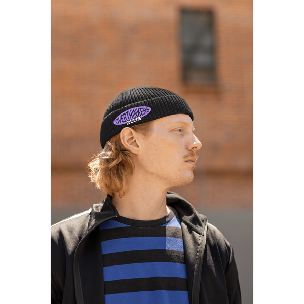 fisherman-beanie-mockup-featuring-a-serious-man-in-a-hip-hop-style-posing-on-the-street-m39231
