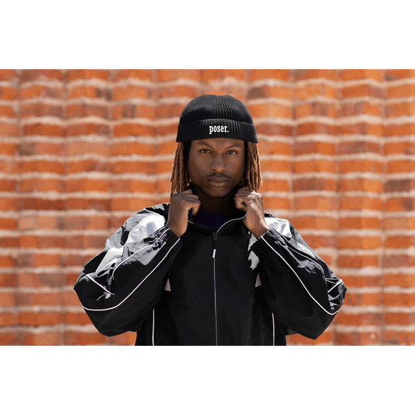 fisherman-beanie-mockup-of-a-man-posing-with-a-serious-look-against-a-brick-wall-m39237_495ff981-157e-4e3e-8725-741426e33bf4