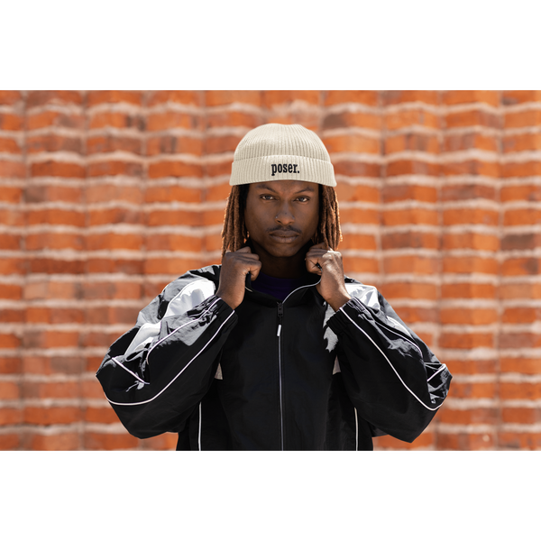 fisherman-beanie-mockup-of-a-man-posing-with-a-serious-look-against-a-brick-wall-m39237