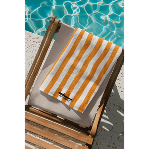 mockup-of-an-ai-generated-beach-towel-folder-on-a-chair-by-the-pool-m40933